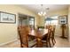 Charming dining room with a wood table and six chairs at 1744 E 16Th Ave, Apache Junction, AZ 85119