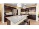 Well-equipped kitchen boasting dark cabinetry and granite countertops at 1744 E 16Th Ave, Apache Junction, AZ 85119