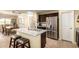 Modern kitchen with stainless steel appliances and an island at 1744 E 16Th Ave, Apache Junction, AZ 85119