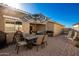 Patio area with dining set and a striped umbrella at 1744 E 16Th Ave, Apache Junction, AZ 85119