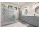 Spa-like bathroom featuring a walk-in shower and gray tile at 20020 N 21St St, Phoenix, AZ 85024