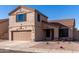 Two-story house with tan exterior, brown roof, and landscaped front yard at 20020 N 21St St, Phoenix, AZ 85024