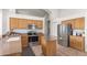 Kitchen with stainless steel appliances and wood cabinets at 20020 N 21St St, Phoenix, AZ 85024