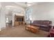 Living room with vaulted ceiling, a built-in entertainment center, and comfortable seating at 20020 N 21St St, Phoenix, AZ 85024