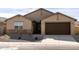 Single-story house with brown garage door and stone accents at 2639 E Santa Ynez Dr, Casa Grande, AZ 85194