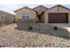 New home with a rock front and two-car garage at 2639 E Santa Ynez Dr, Casa Grande, AZ 85194