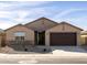 New construction home with a two-car garage and stone accents at 2639 E Santa Ynez Dr, Casa Grande, AZ 85194