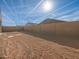 Large, open backyard with dirt and a block wall at 2645 E Santa Ynez Dr, Casa Grande, AZ 85194