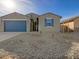 Single-story home with a two-car garage and rock landscaping at 2645 E Santa Ynez Dr, Casa Grande, AZ 85194