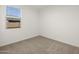 Well-lit bedroom featuring carpeted floor and window at 2665 E Santa Ynez Dr, Casa Grande, AZ 85194