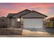 Gray exterior, two-car garage, landscaping, and stone accents at 2665 E Santa Ynez Dr, Casa Grande, AZ 85194