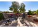 Spacious backyard with seating area under a large tree at 31627 N Poncho Ln, San Tan Valley, AZ 85143