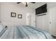 Bright bedroom with a ceiling fan and mounted TV at 31627 N Poncho Ln, San Tan Valley, AZ 85143