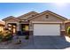 One-story house with a two-car garage and desert landscaping at 31627 N Poncho Ln, San Tan Valley, AZ 85143