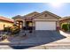 One-story house with desert landscaping and a two-car garage at 31627 N Poncho Ln, San Tan Valley, AZ 85143