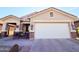 One-story home with two-car garage and festive decor at 31627 N Poncho Ln, San Tan Valley, AZ 85143