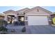 One-story home with two-car garage and festive decor at 31627 N Poncho Ln, San Tan Valley, AZ 85143