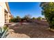 Landscaped front yard with seating area and desert plants at 31627 N Poncho Ln, San Tan Valley, AZ 85143