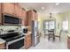 Well-equipped kitchen features stainless steel appliances and a breakfast nook at 31627 N Poncho Ln, San Tan Valley, AZ 85143