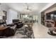 Relaxing living room featuring leather furniture and tile floors at 31627 N Poncho Ln, San Tan Valley, AZ 85143