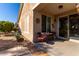 Relaxing backyard patio with seating area, mature plants, and mountain views at 31627 N Poncho Ln, San Tan Valley, AZ 85143