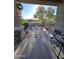 Relaxing covered patio with seating area and desert landscaping at 31627 N Poncho Ln, San Tan Valley, AZ 85143