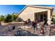 Covered patio with seating area and citrus trees at 31627 N Poncho Ln, San Tan Valley, AZ 85143