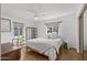 Bright bedroom with a queen bed, wooden desk, and ceiling fan at 3844 N 13Th Ave, Phoenix, AZ 85013