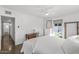 Bedroom with a queen bed, built-in shelving, and an ensuite bathroom at 3844 N 13Th Ave, Phoenix, AZ 85013