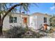 Charming single story home with a well-manicured front yard and orange door at 3844 N 13Th Ave, Phoenix, AZ 85013