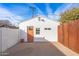 Detached guest house with orange door and a wood fence at 3844 N 13Th Ave, Phoenix, AZ 85013