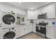 Modern white kitchen with stainless steel appliances at 3844 N 13Th Ave, Phoenix, AZ 85013