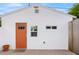 White studio building with orange door, windows, and landscaping at 3844 N 13Th Ave, Phoenix, AZ 85013