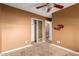 Well-lit bedroom with mirrored closet doors and neutral walls at 4343 E Downing St, Mesa, AZ 85205