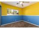 Cheerful bedroom with yellow and blue walls and carpet at 4343 E Downing St, Mesa, AZ 85205