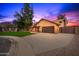 Beautiful brick home with a large driveway and lush lawn at 4343 E Downing St, Mesa, AZ 85205