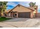 Ranch style home with a 2-car garage and well-maintained lawn at 4343 E Downing St, Mesa, AZ 85205