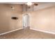 Living room with vaulted ceiling, tile floors and access to hallway at 4343 E Downing St, Mesa, AZ 85205