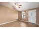 Living room featuring a vaulted ceiling, tile floors, and an arched window at 4343 E Downing St, Mesa, AZ 85205