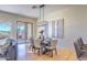 Bright dining area with hardwood floors and a modern chandelier at 7479 E Sunset Sky Cir, Scottsdale, AZ 85266