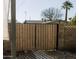 Wooden gate provides secure access to the backyard at 837 E Echo Ln, Phoenix, AZ 85020