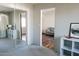 Bedroom with mirrored closet and living room view at 837 E Echo Ln, Phoenix, AZ 85020