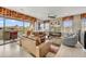 Tan leather couches and chairs in a light and airy living room at 10260 E White Feather Ln # 2035, Scottsdale, AZ 85262