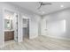 Bedroom with wood-look floors, and access to bathroom and closet at 13924 E Windstone Trl, Scottsdale, AZ 85262