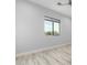 Bedroom with light wood-look floors and window view at 13924 E Windstone Trl, Scottsdale, AZ 85262