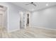 Bright bedroom with wood-look floors and private bathroom at 13924 E Windstone Trl, Scottsdale, AZ 85262