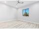 Well-lit bedroom featuring wood-look floors and a window with a view at 13924 E Windstone Trl, Scottsdale, AZ 85262