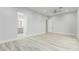 Spacious bedroom with wood-look floors and en-suite bathroom access at 13924 E Windstone Trl, Scottsdale, AZ 85262