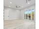 Bright bedroom featuring wood-look floors and access to a private patio at 13924 E Windstone Trl, Scottsdale, AZ 85262