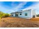 Back of house with covered patio and desert view at 13924 E Windstone Trl, Scottsdale, AZ 85262
